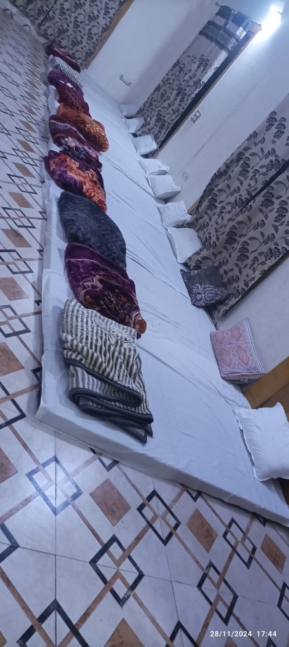 Indoor Guest Lodging Bedding Layout with Mattresses & Blankets